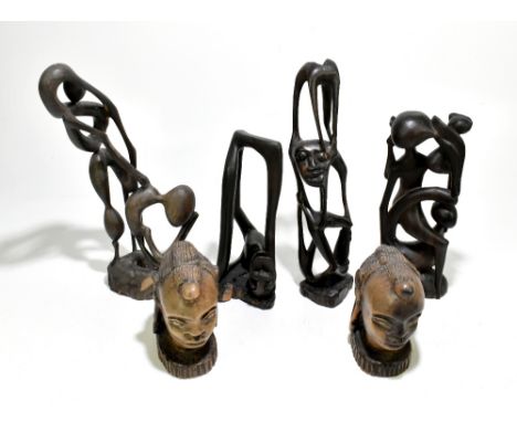 ETHNOGRAPHIA; four Nigerian West African carved hardwood figures, the tallest 40cm, together with a pair of Nigerian carved h