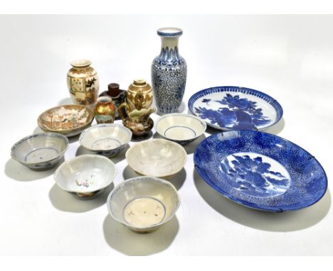 Two Japanese blue and white chargers, one decorated with a landscape, the other decorated with peacocks, diameter of each 35c