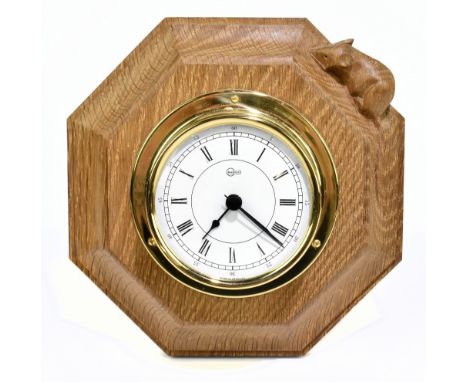 ROBERT 'MOUSEMAN' THOMPSON; an octagonal carved oak wall clock, with Barigo clock face and quartz movement, diameter 18cm.Add