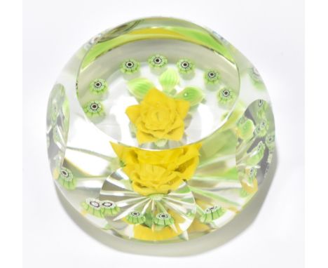 WILLIAM MANSON; a limited edition faceted glass paperweight 'Pourtoi' set with a central flower flanked by floral canes, no.2
