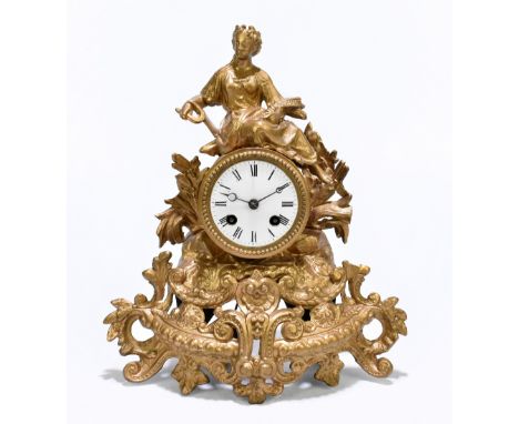 A 19th century gilt spelter eight day mantel clock, the dial set with Roman numeral dial and movement striking on a bell, the