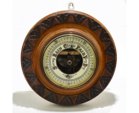 THOMAS ARMSTRONG &amp; BROTHERS OF 88 &amp; 90 DEANSGATE MANCHESTER; a late 19th century carved oak circular barometer, diame