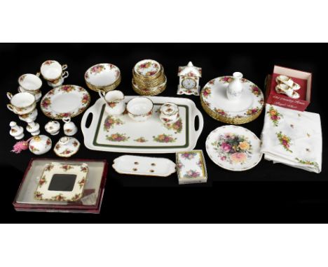 ROYAL ALBERT; a collection of 'Old Country Roses' tableware and part dinner service including mantel clock, six dinner plates
