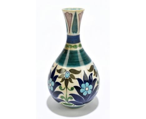 LEONARD KING FOR BURMANTOFTS; an art pottery vase of baluster form with flared neck, with floral decoration, impressed and pa