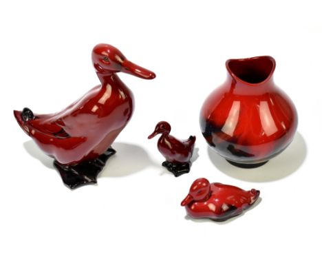 ROYAL DOULTON; three flambé figures comprising a duck and ducklings, height of duck 15cm and a veined flambé vase, no.3605, h