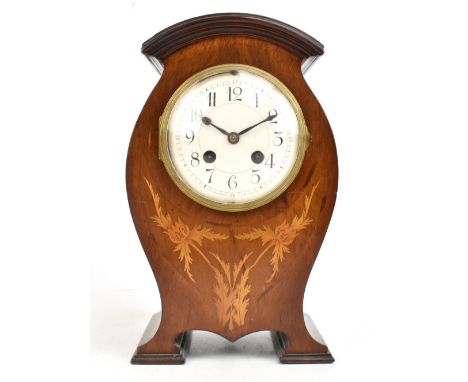 An Edwardian French marquetry inlaid mantel clock, the arched top above circular enamelled dial set with Arabic numerals, hei