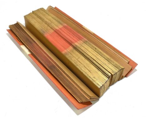 A Buddhist palm manuscript with red lacquer ends enclosing multiple palm leaves, length 51cm.