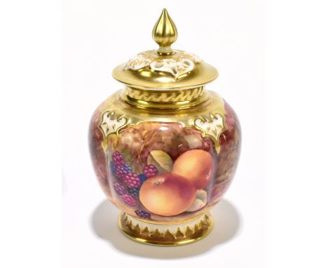 ROYAL WORCESTER; a hand painted pot pourri and cover decorated with fruit inside gilt detail, by J Skerrett, height 13.5cm.Ad