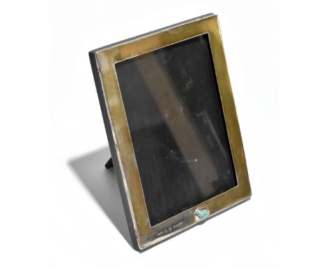 LIBERTY &amp; CO; an Edward VII hallmarked silver mounted easel back photo frame set with cabochon, with Cymric stamp, Birmin