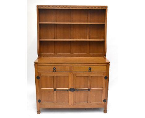 ROBERT 'MOUSEMAN' THOMPSON; a light oak high back dresser, the panelled back with two open shelves, above two short drawers a