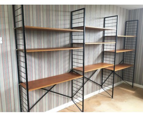 LADDERAX; nine shelves and four metal uprights with gilt metal support bars, the uprights height 201cm, shelves 104.5cm wide.