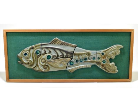A 1970s ceramic five sectional wall plaque representing a fish, with moulded decoration and glazed highlights backed on a hes