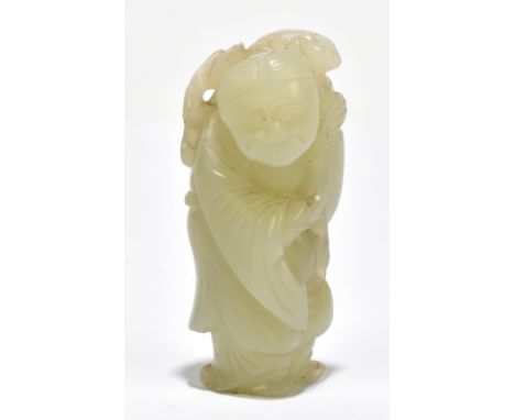 A Chinese jade carving representing an elder holding a ruyi, height 6cm.