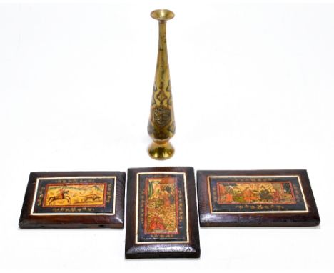 Three Persian lacquered panels, one decorated with a hunting scene, one decorated with four figures in a garden and another d