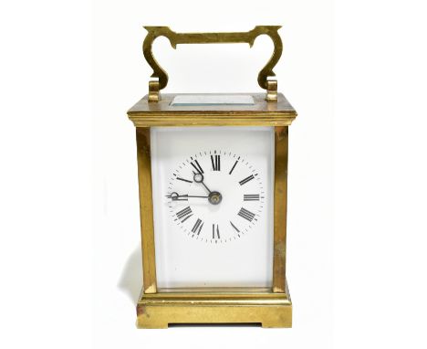 A 19th century French brass cased carriage clock, the enamel dial set with Roman numerals, with swan neck swing handle, heigh