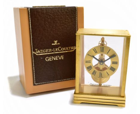 JAEGER-LECOULTRE; a gilt brass Atmos type carriage timepiece, the chapter ring set with Roman numerals, the underside of the 