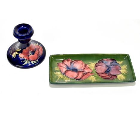 MOORCROFT; two pieces in 'Anemone' pattern comprising a squat form candlestick, height 9cm and a rectangular pin tray, length