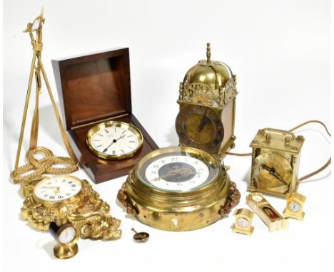 An assortment of modern timepieces comprising a Swiss gilt metal cartel type wall timepiece, a brass bulkhead type timepiece 