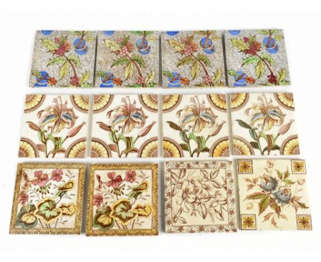 A collection of twelve Victorian dust pressed tiles including two decorated with geraniums within a yellow border, a sepia co