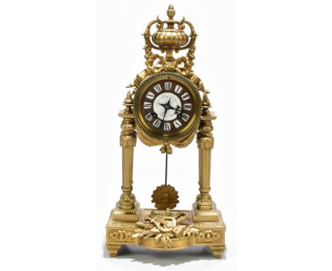 AUX LOUIS D'OR PALAIS-ROYAL; a 19th century French gilt spelter eight day mantel clock, the brass dial with enamel Roman nume