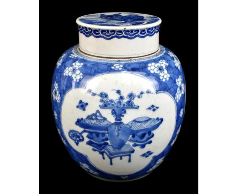 A late 19th century Chinese blue and white ginger jar and cover, the cover painted with a shishi dog, the outer edge with ruy