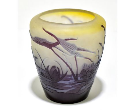EMILE GALLÉ (1846-1904); an Art Nouveau cameo glass vase of tapering cylindrical form decorated with a river scene with lily 