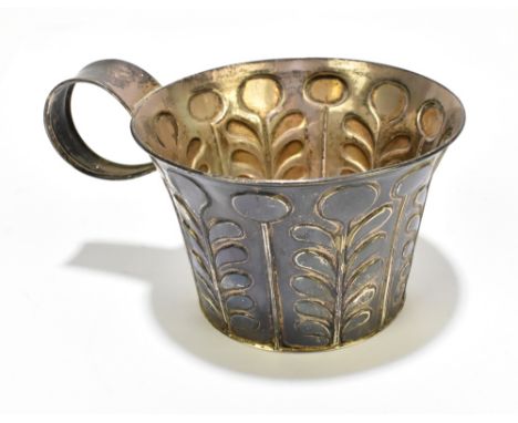 GEORGE NATHAN &amp; RIDLEY HAYES; an Edward VII hallmarked silver beaker in the arts &amp; crafts manner with strap handle an