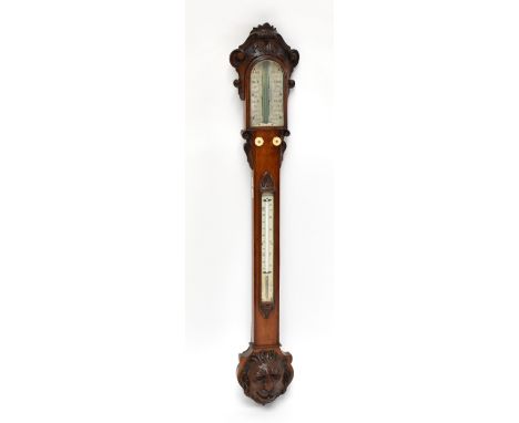 W BANKS OF BOSTON; a 19th century oak stick barometer, with carved detail to the top and edges and a lion mask head applied r