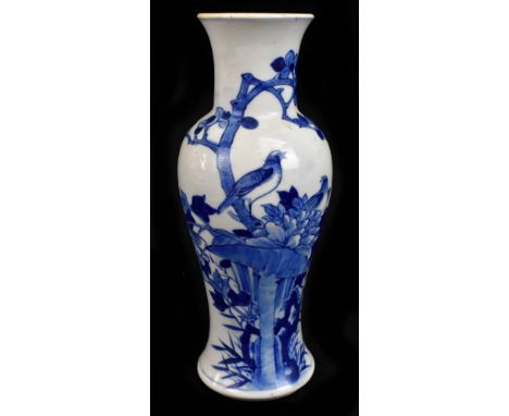 A late 19th century Chinese Kangxi style blue and white vase, decorated with two birds and flowers around rock work, concentr