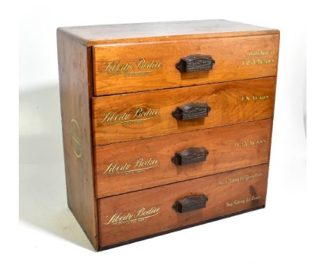 LIBERTY BODICE; a vintage haberdashery tabletop chest of four long drawers, each drawer with a cast iron handle with the name
