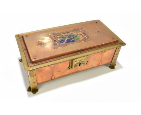 An Arts & Crafts copper and brass mounted casket of rectangular form, the cover with central enamelled panel flanked by repou