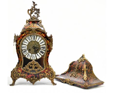 A Louis XV style gilt brass and faux tortoiseshell mantel clock and bracket, the cast brass dial with Roman numeral tablets, 
