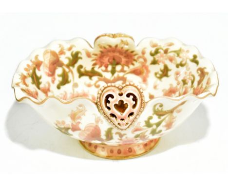 ZSOLNAY PECS; a footed bowl with wavy rim and heart shaped motifs, with painted floral decoration, printed marks and impresse