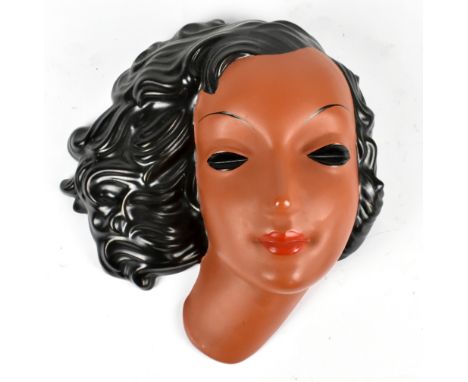GOLDSCHEIDER; a terracotta wall mask representing a maiden with black flowing hair and impressed marks and no.7420-31711 to r