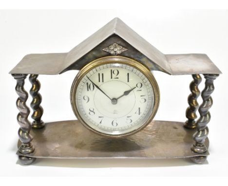 ATTRIBUTED TO ALBERT EDWARD JONES; a silver plated Arts &amp; Crafts mantel timepiece, planished decoration, the central enam