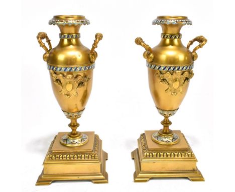 A pair of 19th century French lacquered brass and enamel twin handled cassolettes, on stepped square bases, possibly side orn