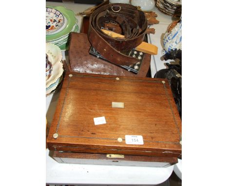A hardwood cuckoo clock, a leather Sam Browne military belt, a composite horse racing sculpture, an ostrich skin handbag, (a/