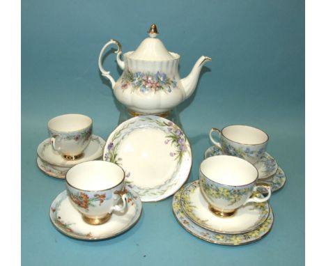 A Royal Albert ceramic teapot and four Queen Anne China trios, all hand-painted with Western Australian wild flowers by Flore