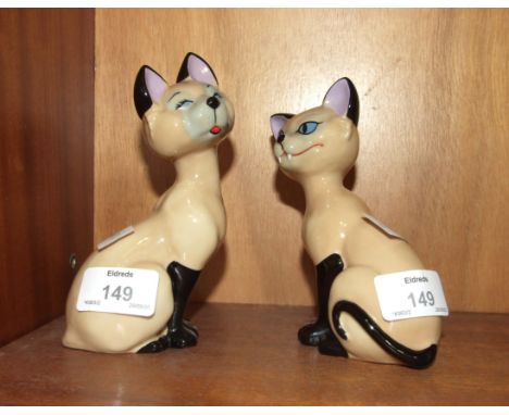A pair of Wade Disney blow-up figures, 'Si' and 'Am', 14cm high, (2).
