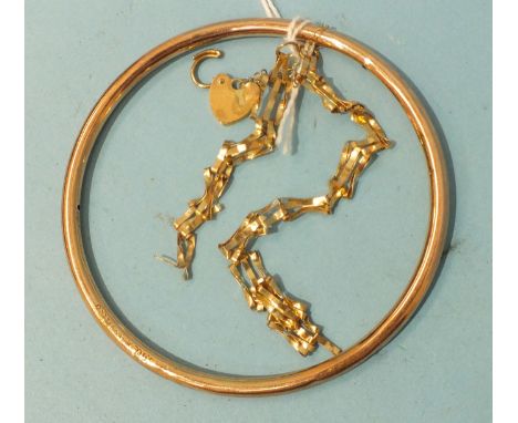 A 9ct gold (wax-filled) slave bangle, 5.8g and a broken 9ct gold bracelet, 3g, (2).