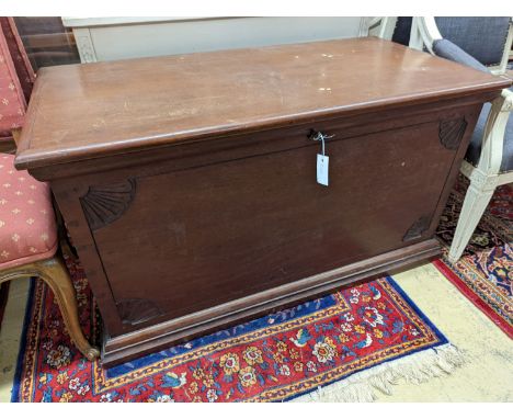 A large rectangular carved teak trunk, length 116cm, depth 58cm, height 64cm