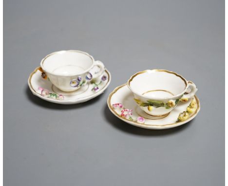 Two Rockingham miniature flower encrusted cups and saucers, c.1830. Provenance - Mona Sattin collection of miniature cups and