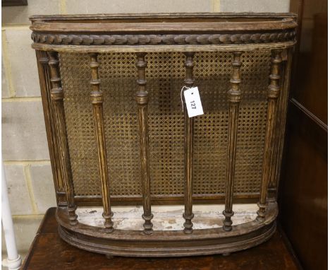 An early 20th century caned beech four division stick stand, width 73cm, depth 20cm, height 68cm