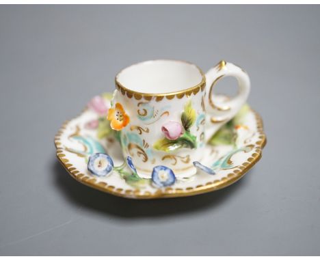 A Coalbrookdale miniature flower encrusted cup and saucer, c.1820. Provenance - Mona Sattin collection of miniature cups and 