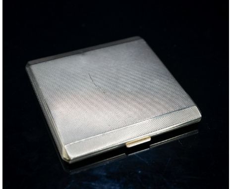 A 1930's engine turned 9ct gold cigarette case, 82mm, gross 98.3 grams.