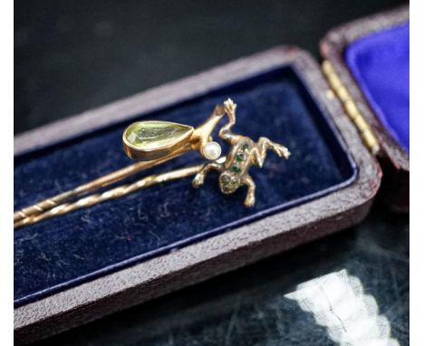 An early 20th century 9ct and gem set frog stick pin, stamped MB &amp; Cie, 57mm and one other 9c and gem set stick pin, gros