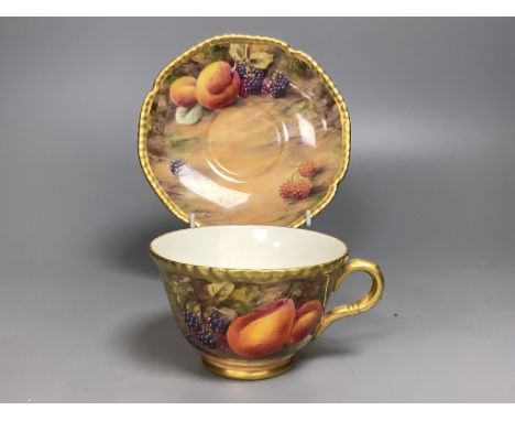 A Royal Worcester fruit painted large tea cup and saucer, signed P. Love, height 7cm overall