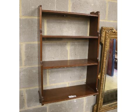 A mahogany three shelf wall bracket, width 57cm, depth 23cm, height 94cm