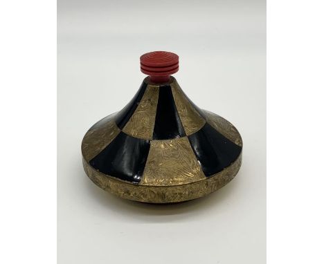 A French Art Deco gilt metal and black enamel powder with red celluloid finial and mirror to inside of lid