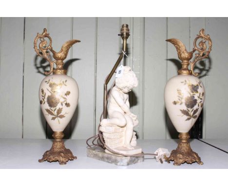 Pair of gilt metal and opaque glass ewers together with a cherub table lamp, 48cm and 49cm.